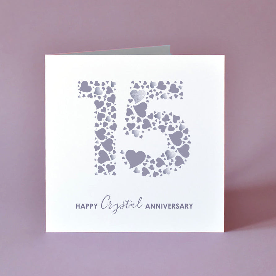 Vibrant 'Happy Crystal Anniversary' card featuring a prominent '15' created from love hearts. A unique 15th wedding anniversary greeting card for couples.