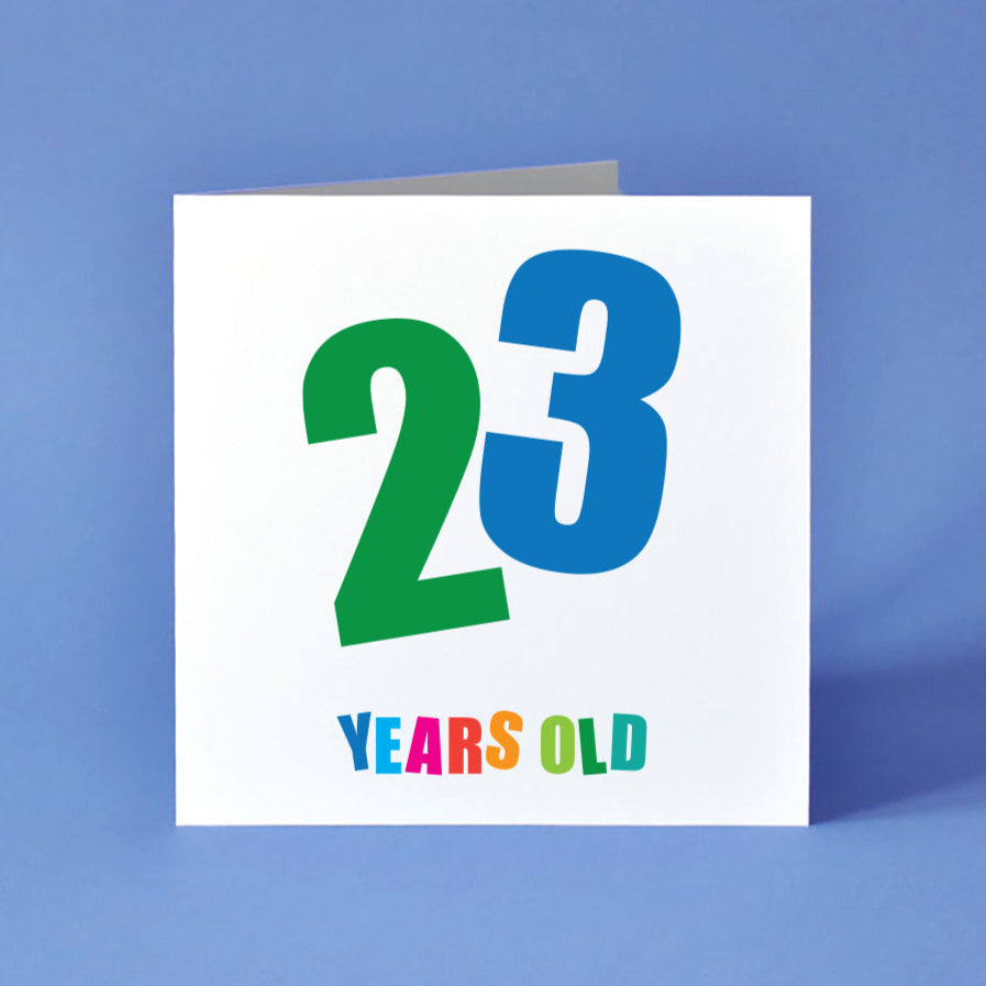 A gender-neutral birthday card with a striking '23' right in the middle, each number in a different bold colour and set at a cool angle. "Years Old" is below, with each letter vibrant and distinct.