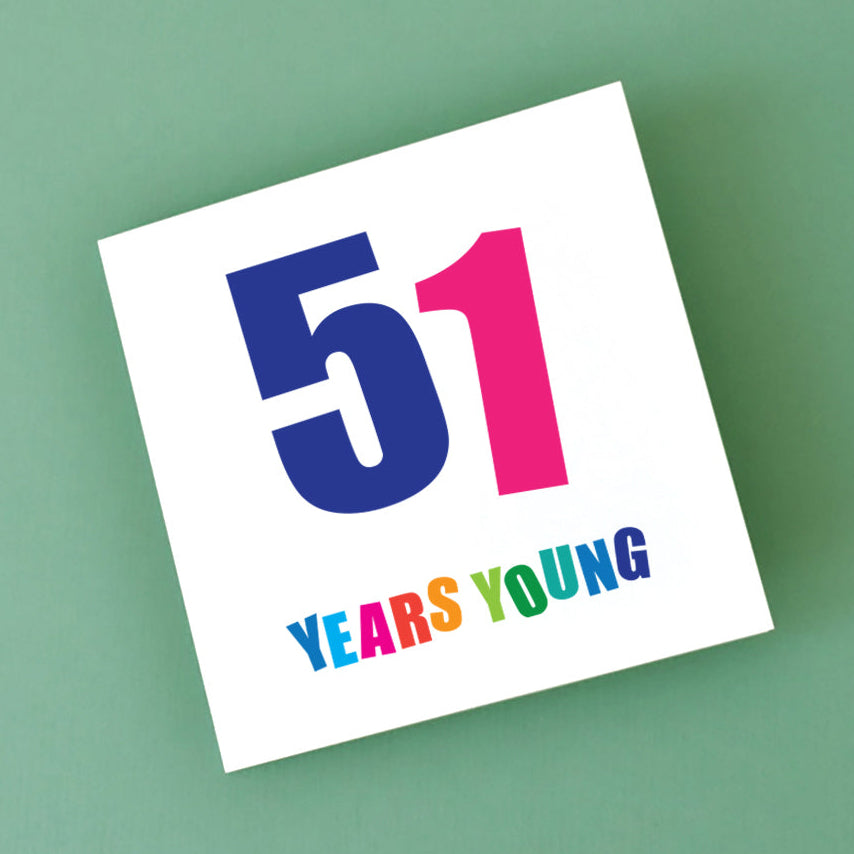 Close-up of a cheerful 51st birthday card with bright letters and a fun, energetic celebration theme.