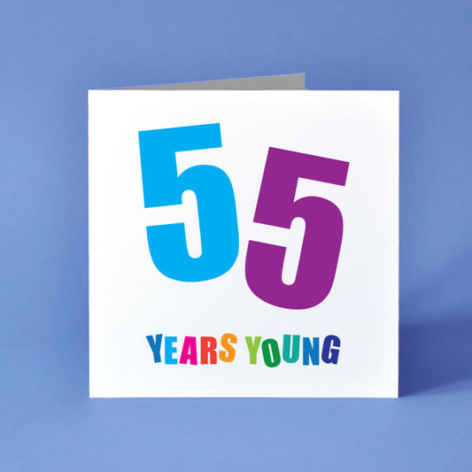 Square white birthday card showing the large, bold number "55." Each "5" is set at a different angle and in a different bold colour, blue and purple. The phrase "Years Young" appears below, with every letter in its own bold colour.