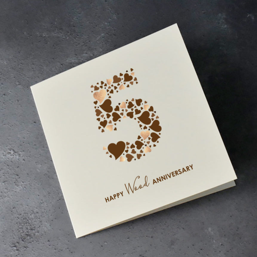 Cream card with a number five and 'Happy Wood Anniversary' text underneath.