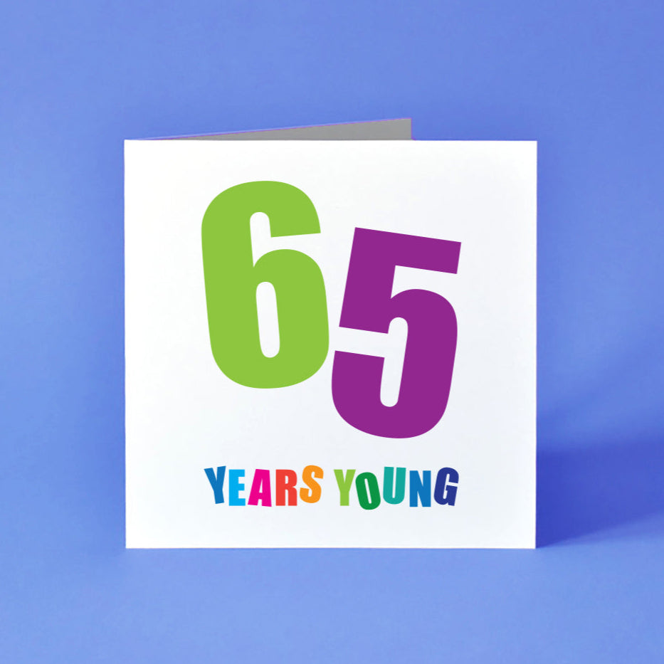 Large number 65 in green and purple with a multicoloured Years Young underneath.