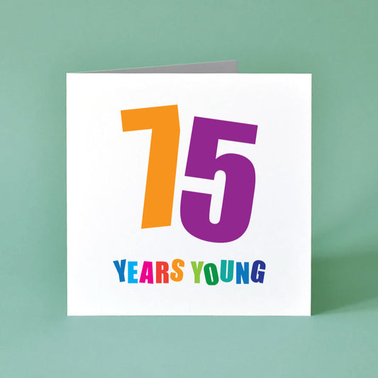 75 Years Young Birthday Card with bold colourful numbers and text.