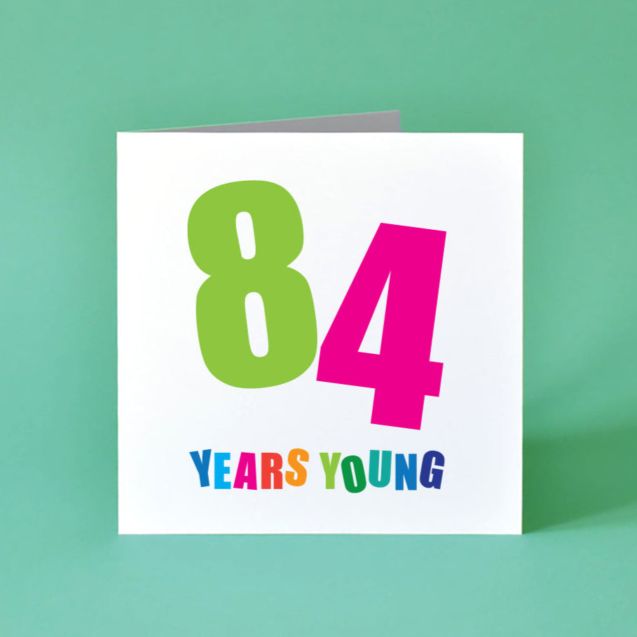 84 Years Yuung Birthday Card for Her with bold, colourful text.
