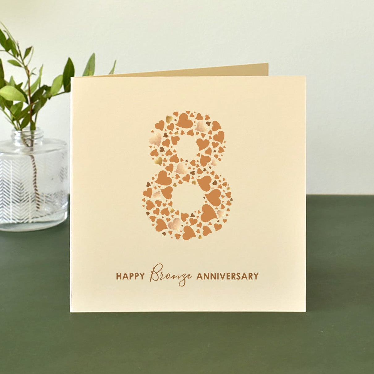 8th anniversary card with number 8 made from an array of love hearts and 'Happy Bronze Anniversary' text underneath.