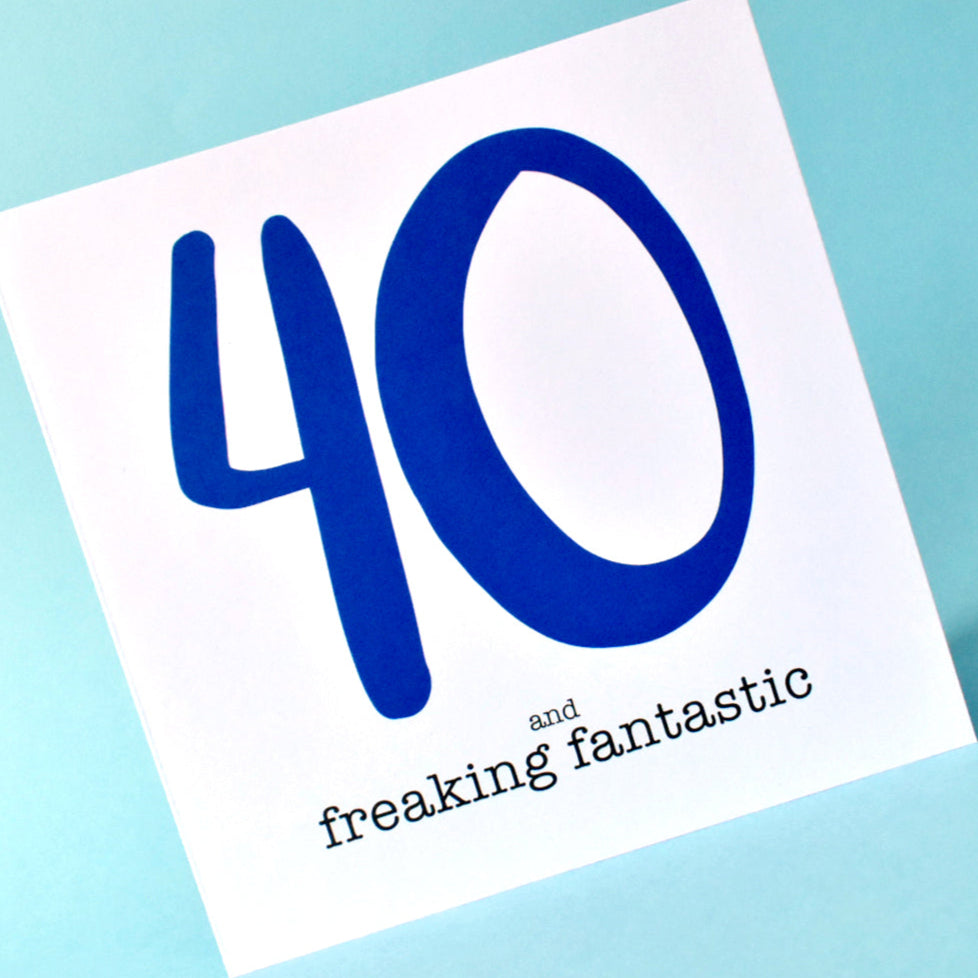 Close-up of 40 and freaking fantastic birthday card, with bold navy and black typography.