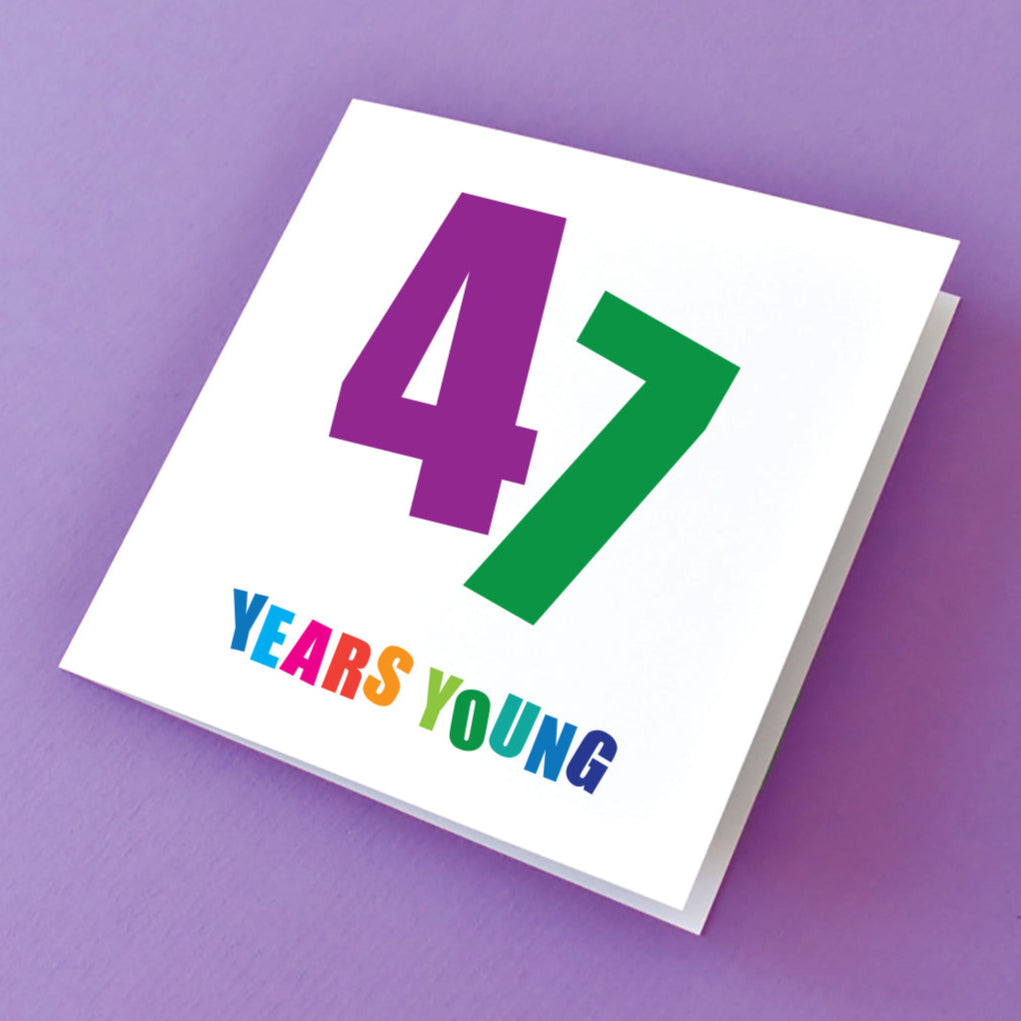 Greeting card with '47 Years Young' text in multi colours.