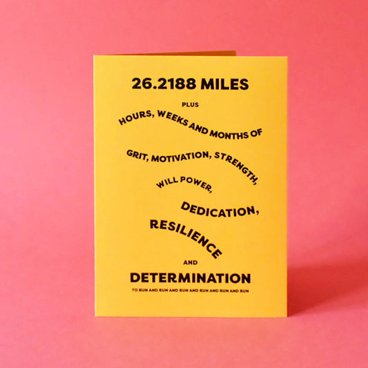 Card that reads "26.218 miles plus hours, weeks and months of grit, motivation, strength, will power, dedication, resilience and determination".