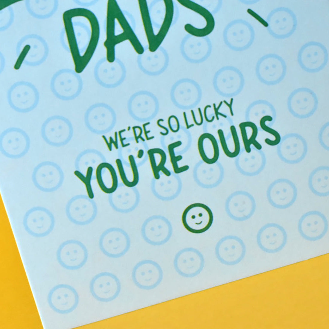 Pale blue card with lots of smiley faces on it plus sentimental wording for Father's Day or dad’s birthday.