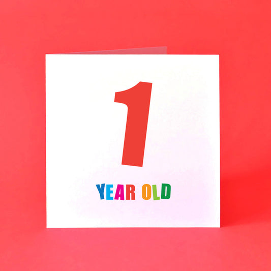 Card with '1 YEAR OLD' text in bright, bold colours.
