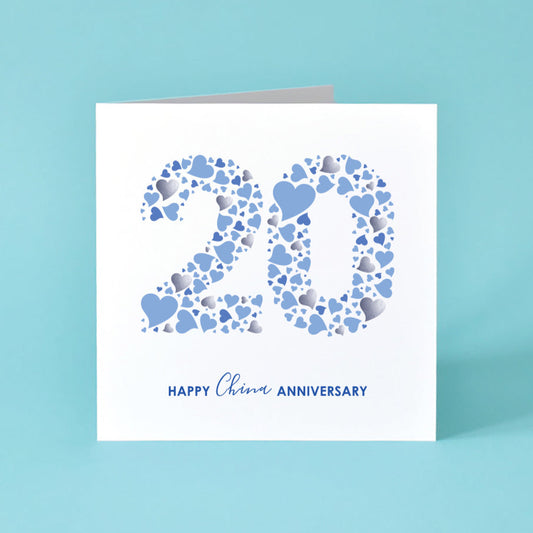 White square anniversary card with 'Happy China Anniversary' text in blue. Above this is a large 20 made from lots of small love hearts in shades of blue, some with a shimmering effect.