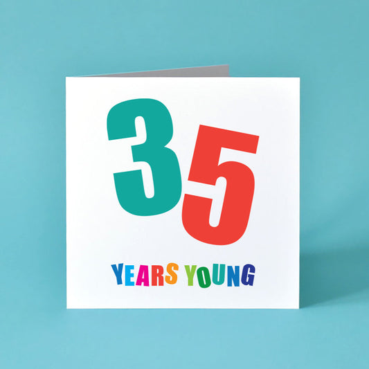 Square white birthday card with the large, bold number "35" prominently displayed. Each digit of "35" is at a different angle and in a different bold colour. Below the number, the words "Years Young" are written, with each letter in a different bold colour.