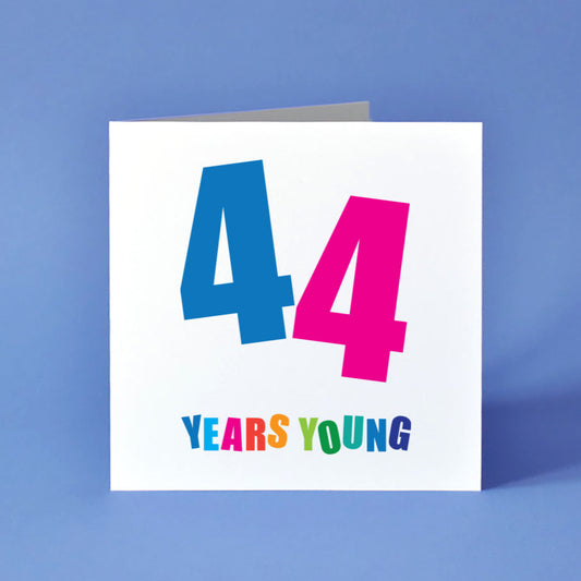 A birthday card where a prominent '44' takes the spotlight, with each twin digit in a different vibrant colour and angled dynamically. "Years Young" appears below, each letter bursting with its own distinct, cheerful hue.