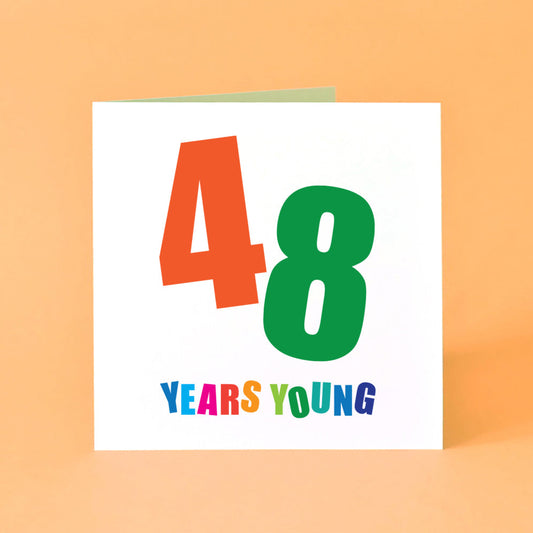 The birthday card's design features a striking '48', with each digit in a different vibrant colour and angled dynamically. Underneath, "Years Young" completes the message, each letter vibrant and distinct.