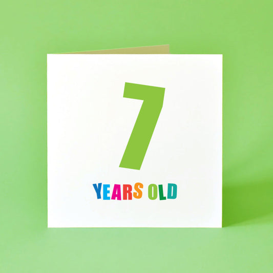 Birthday card  for kids with '7 years old' text in bright colours on a white background.