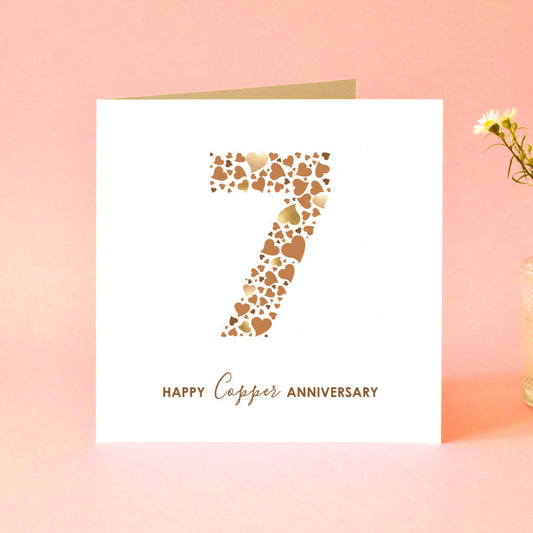 Anniversary card with a number 7 made from lots of different size love hearts in shades of brown and 'Happy Copper Anniversary' underneath.