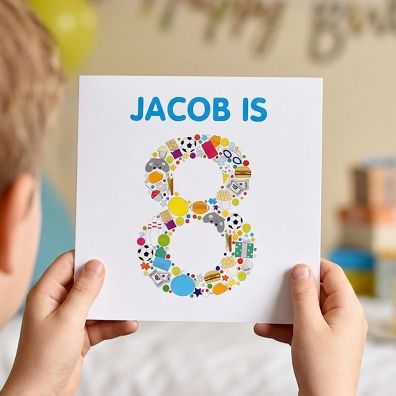 Child holding a card with 'JACOB IS 8' at a birthday party.