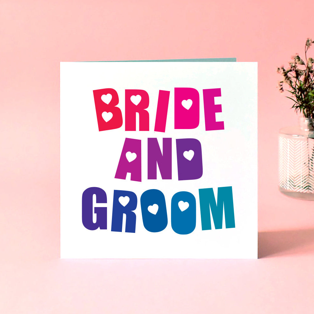 A wedding card with the words 'Bride and Groom' in a colourful rainbow blended typography.
