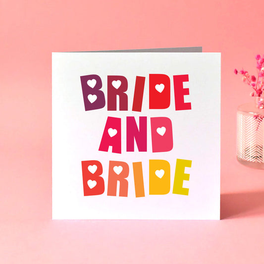 A colourful rainbow blended wedding card with the words 'Bride and Bride' in bold.
