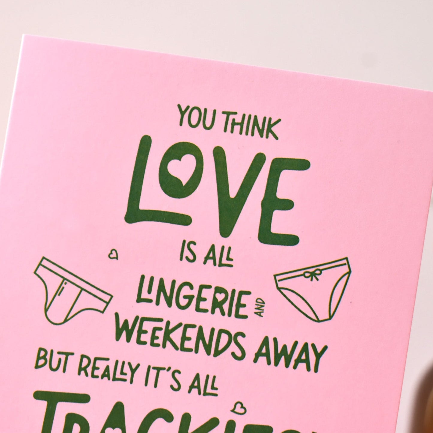 Pink card with green text and illustrations of underpants and knickers. Funny Love Card.