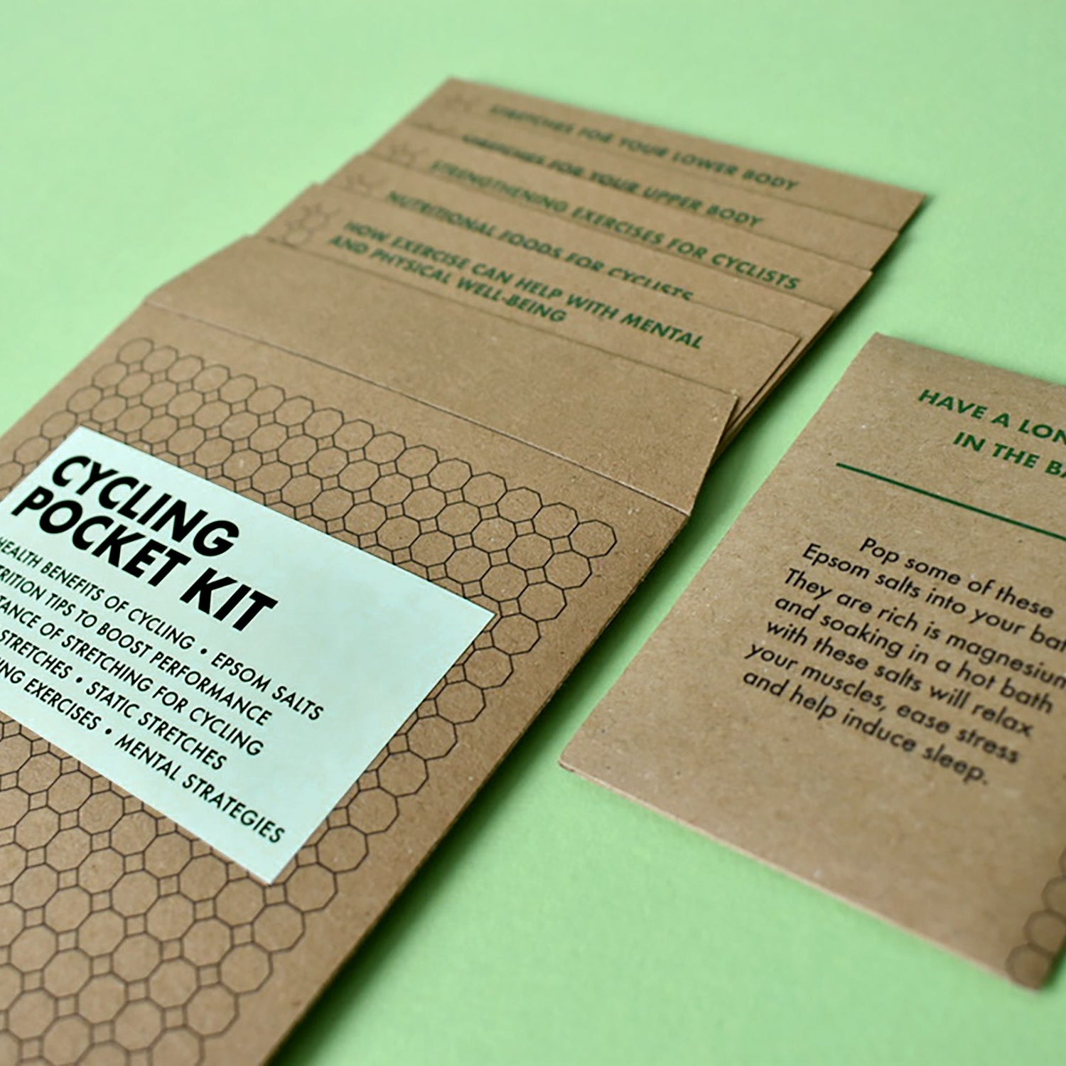 Close-up of cycling gift cards detailing stretches, nutrition tips and mental strategies for cyclists.