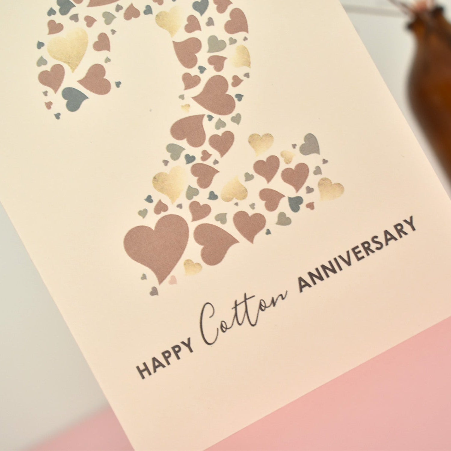 Close up of love hearts that make up the number 2 on the anniversary card.