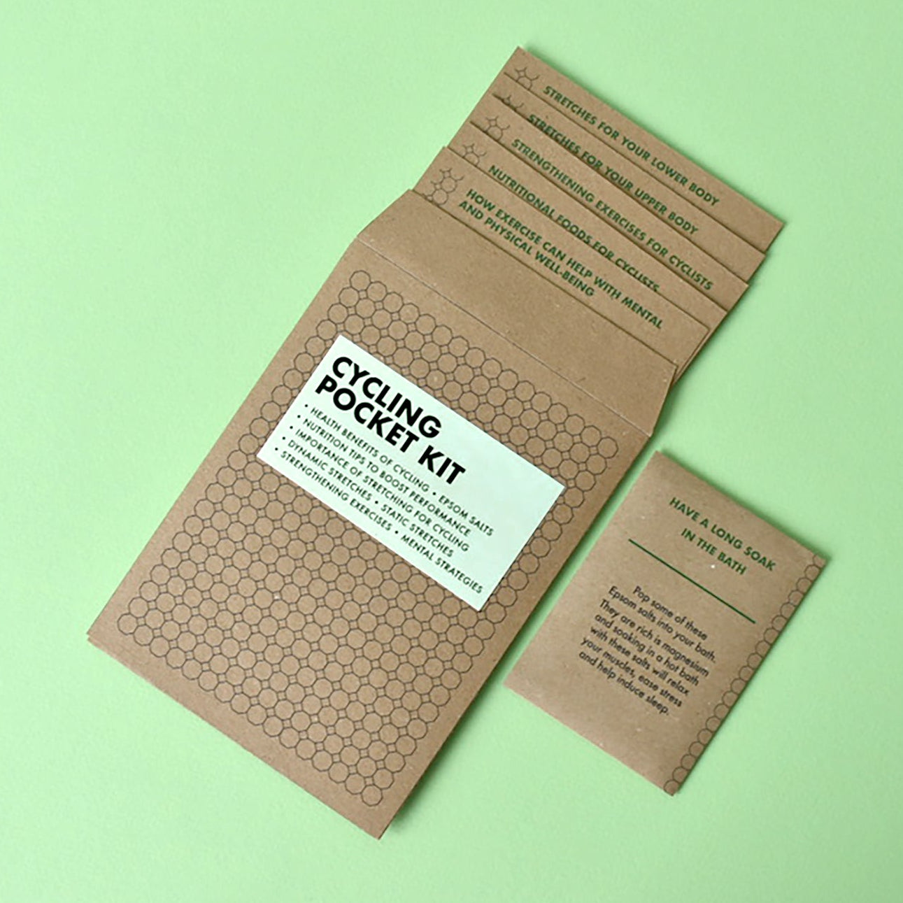 Minimalist kraft paper packaging for a unique cycling pocket gift kit.