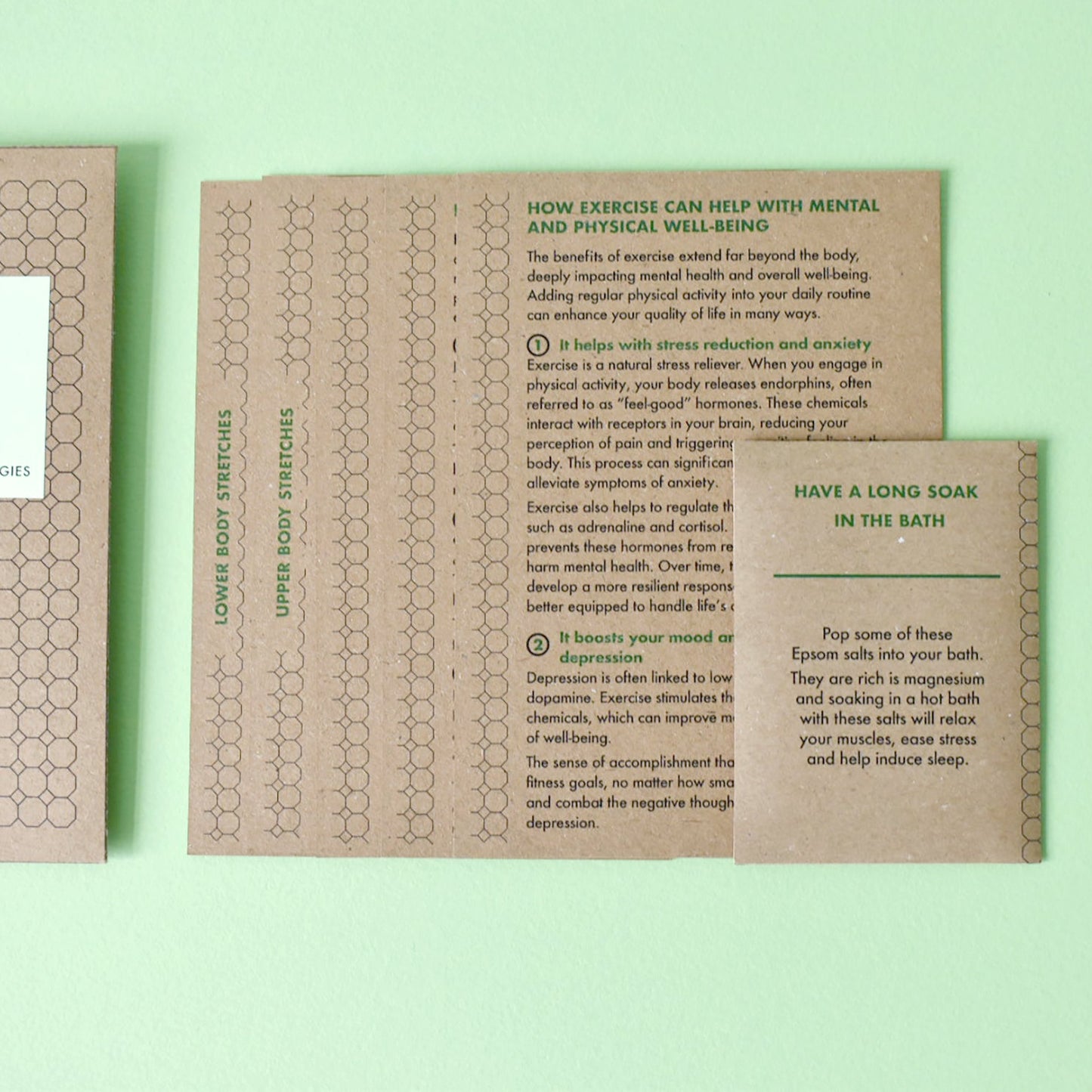 Close-up of cyclist training cards showing strengthening exercises and mental strategies.