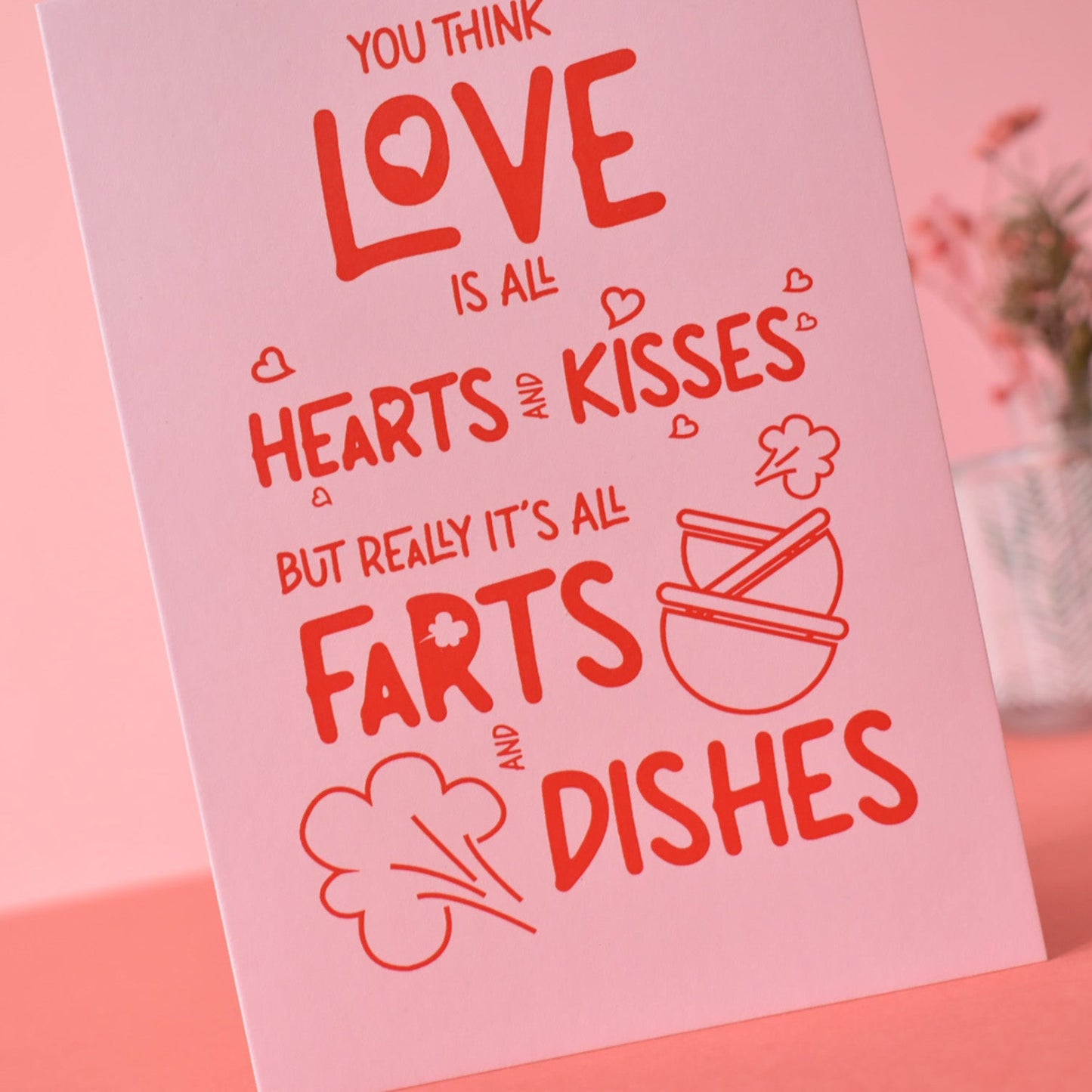 Pink card with humorous text on a pink background