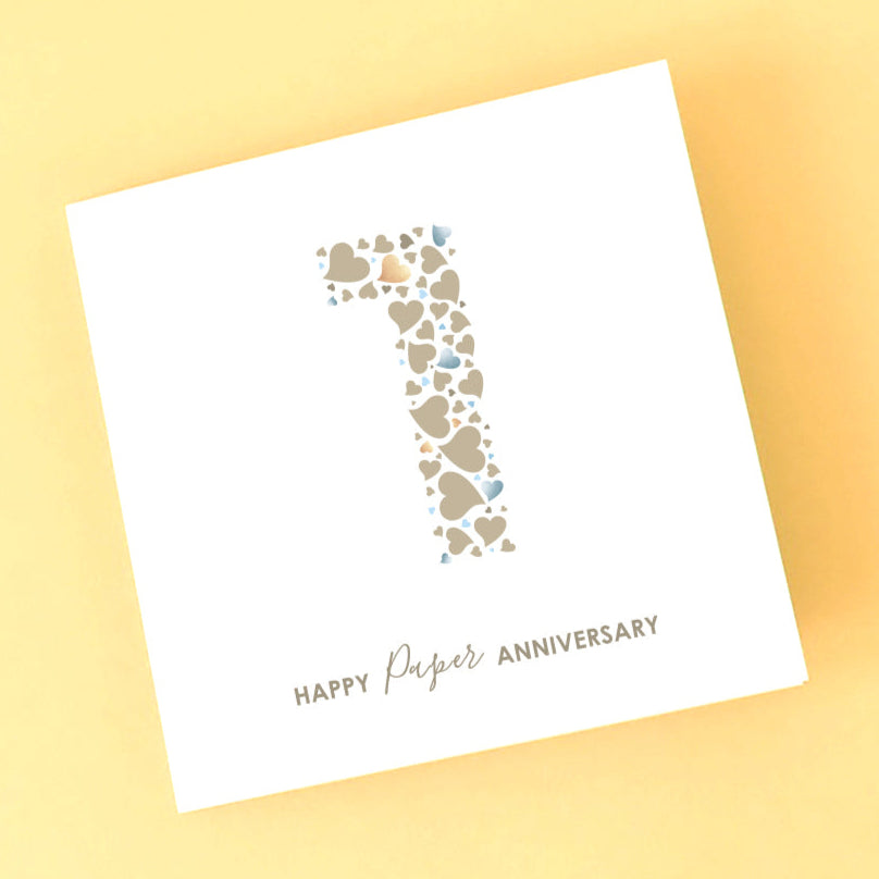 Card with heart arrangement and 'Happy Paper Anniversary' text on a white background.