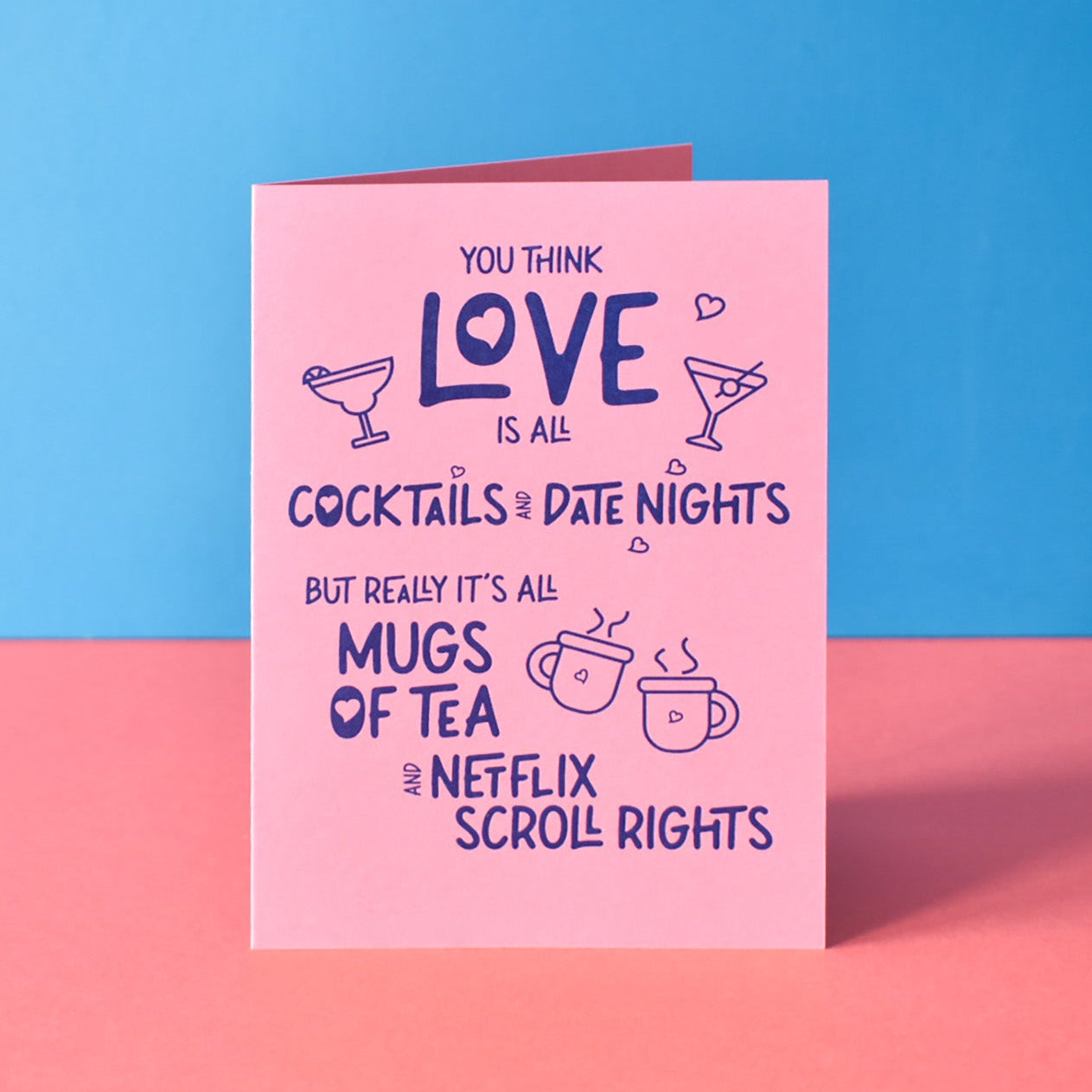 Card with humorous text on a pink and blue background