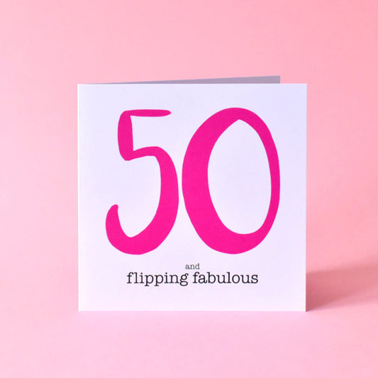Greeting card with large bright pink '50' and 'and flipping fabulous' text in black underneath.