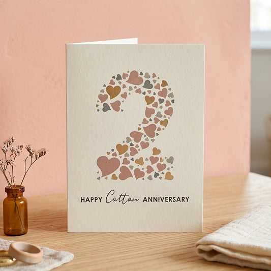 Cream card with heart design to form a large number 2 and underneath are the words 'Happy Cotton Anniversary'.