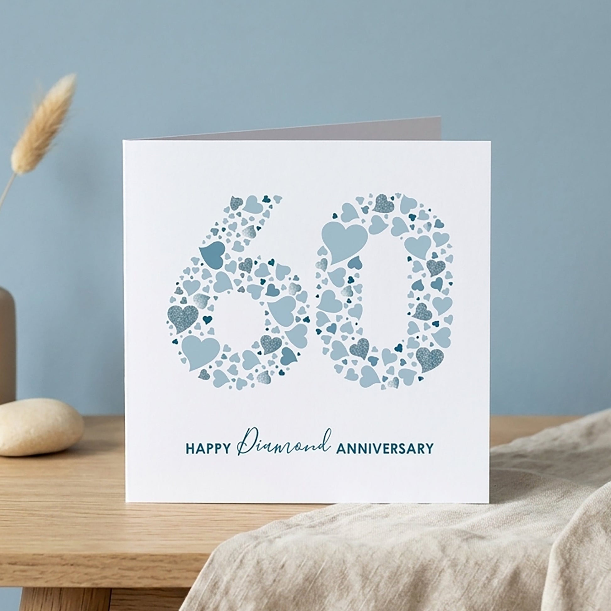 60th anniversary card with a modern blue heart design forming a large number 60 with the printed greeting Happy Diamond Anniversary.