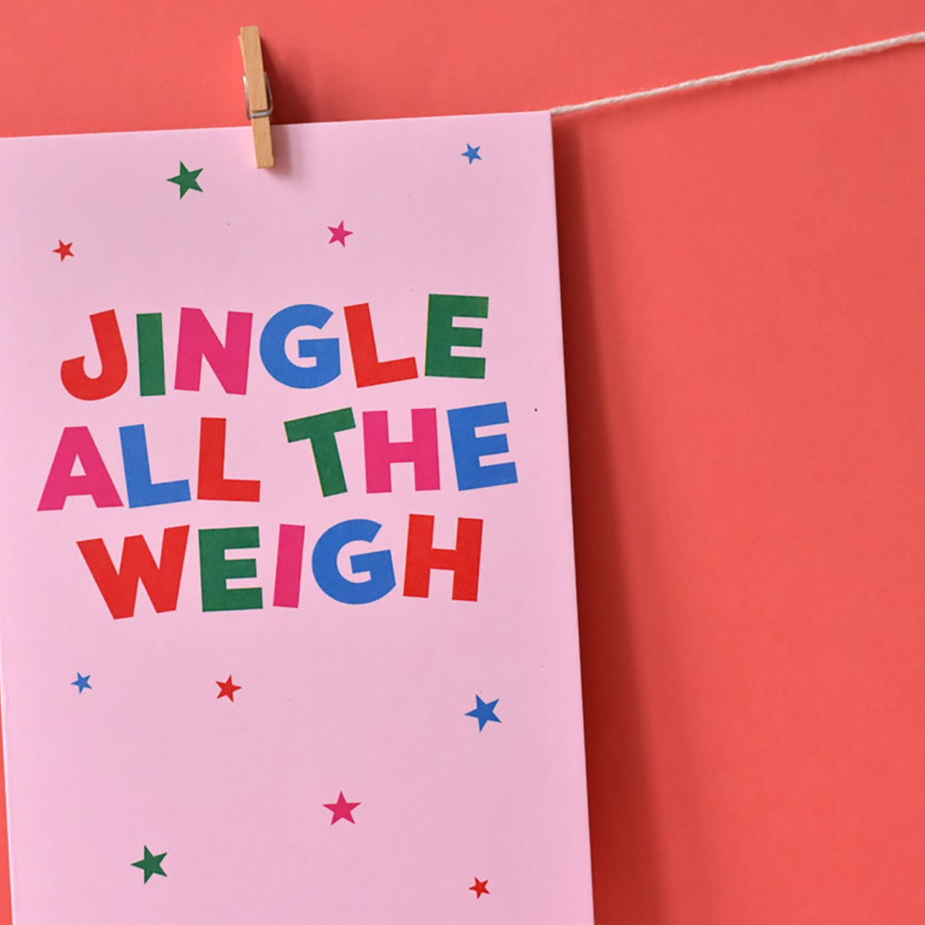 Pink funny Xmas Card with 'JINGLE ALL THE WEIGHT' text in lots of colours.
