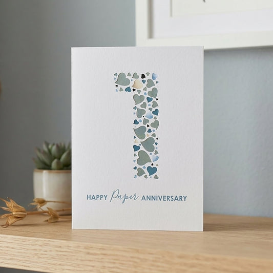 Card with a huge number '1' and 'Happy First Anniversary' text on a white background.