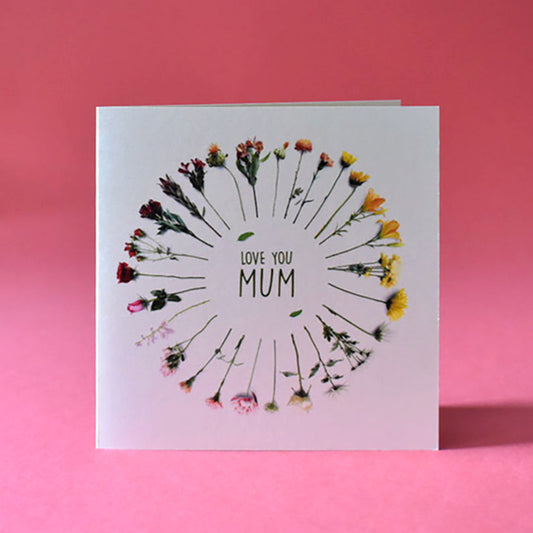 Floral card that features a circle of flowers and the message Love You Mum in the centre.