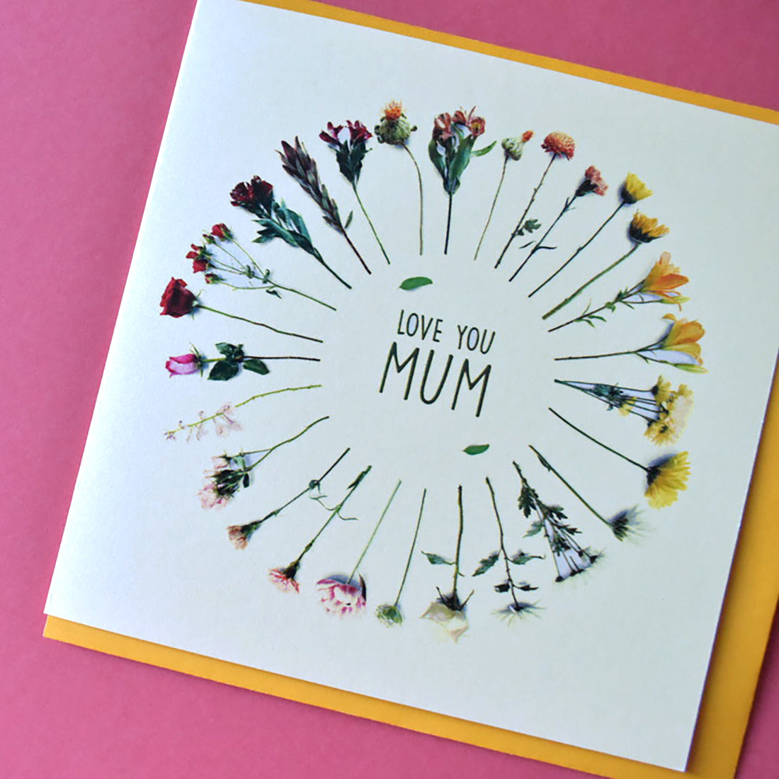 Love You Mum card with a circle of different types of flowers.