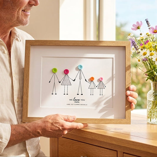 Papa holding the framed personalised print given to him from his grandchildren for Fathers Day.