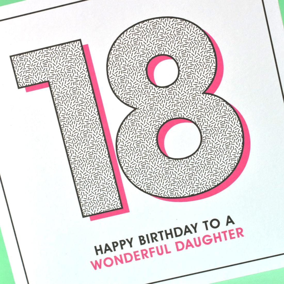 Pink and patterned 18th birthday card for daughter who’s officially an adult.